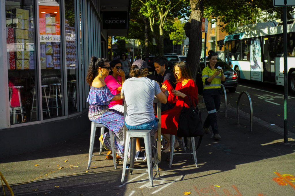 Outdoor Cafe Patrons at Sunset in Sydney Australia / © jaaske