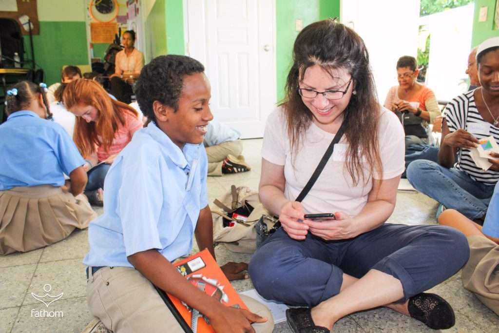 Me with a student in the Dominican Republic while on a Fathom cruise / Melody Moser