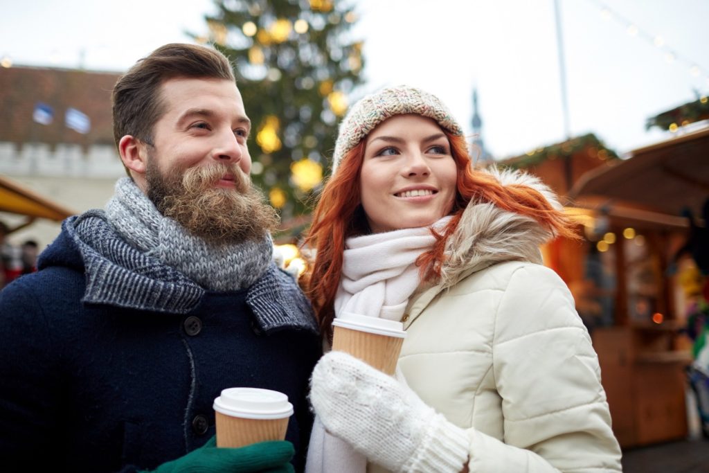 Couple drinking coffee in Europe by Syda Productions