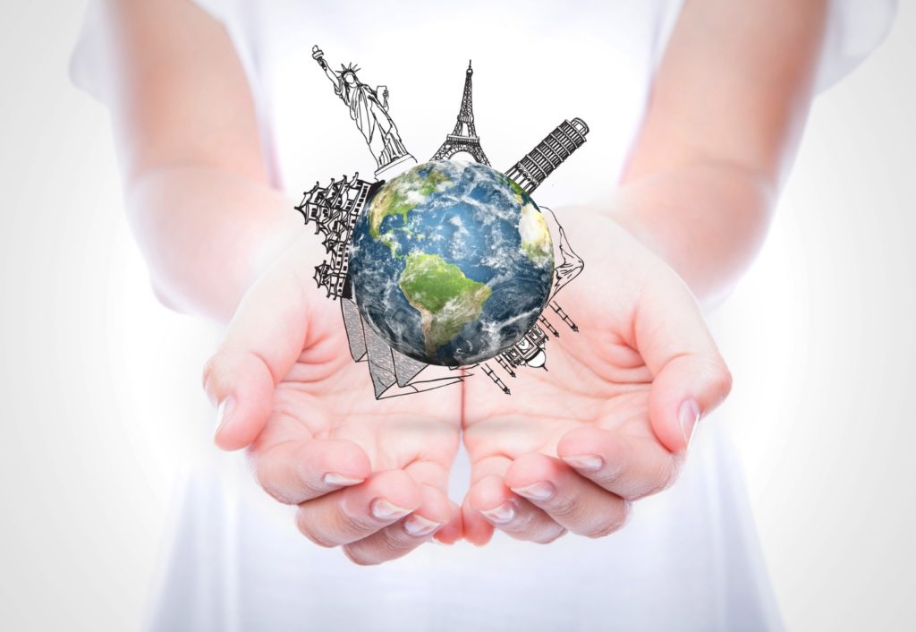 Hands holding the world. Image: jannystockphoto