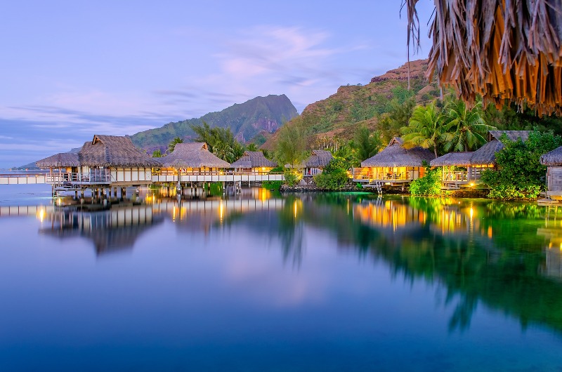 Overwater bungalows in the evening by marcorubino.