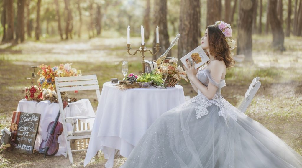 Bride at fancy table in woods