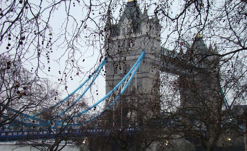 Tower Bridge under gloomy skies.