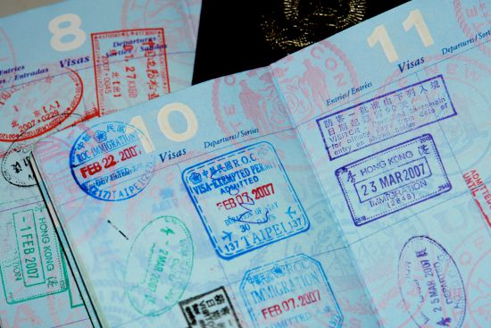 Image of Passport stamps/Credit: J Aaron Farr, Flickr, CC 2.0