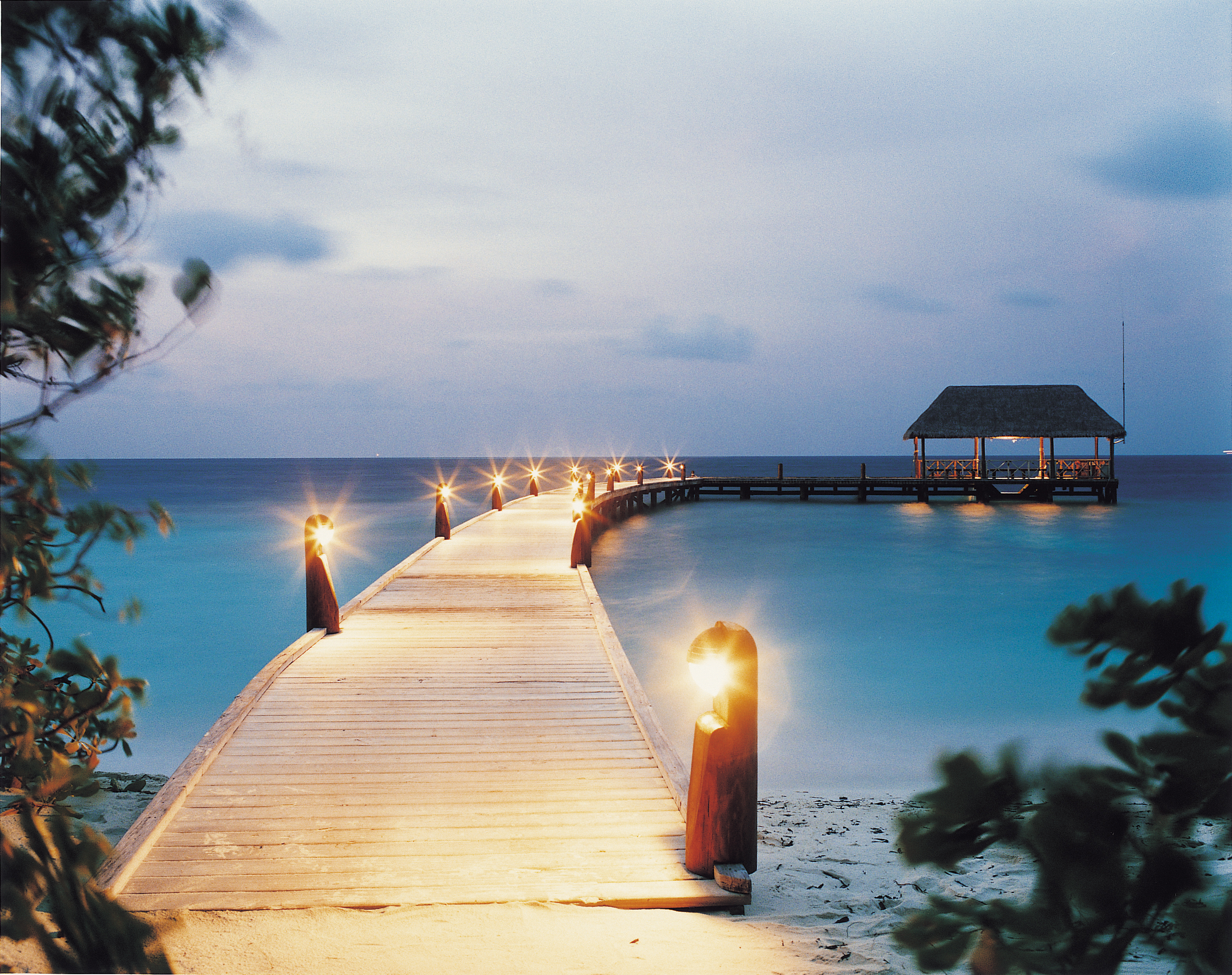 Arrival jetty at night, COMO Cocoa Island, Makunufushi, South Male Atoll, Maldives / COMO Hotels and Resorts