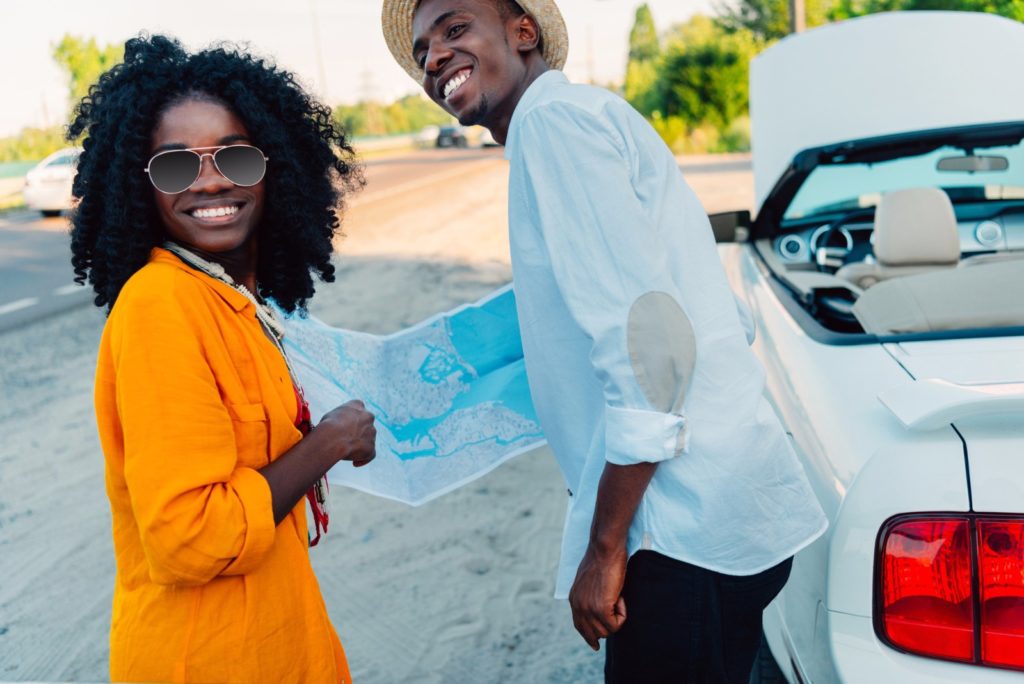 African american couple with map / Copyright: ArturVerkhovetskiy