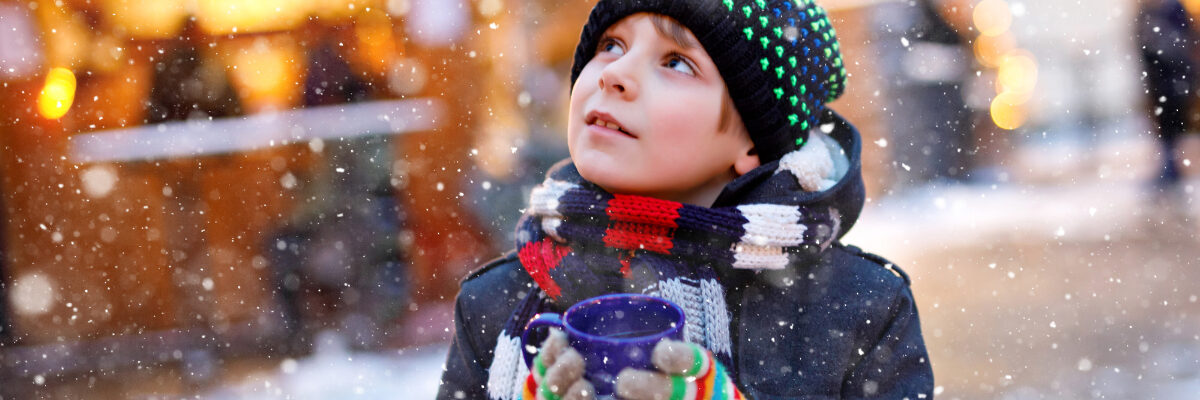 Boy drinking hot punch at the Nuremberg Christmas Market by Romrodinka