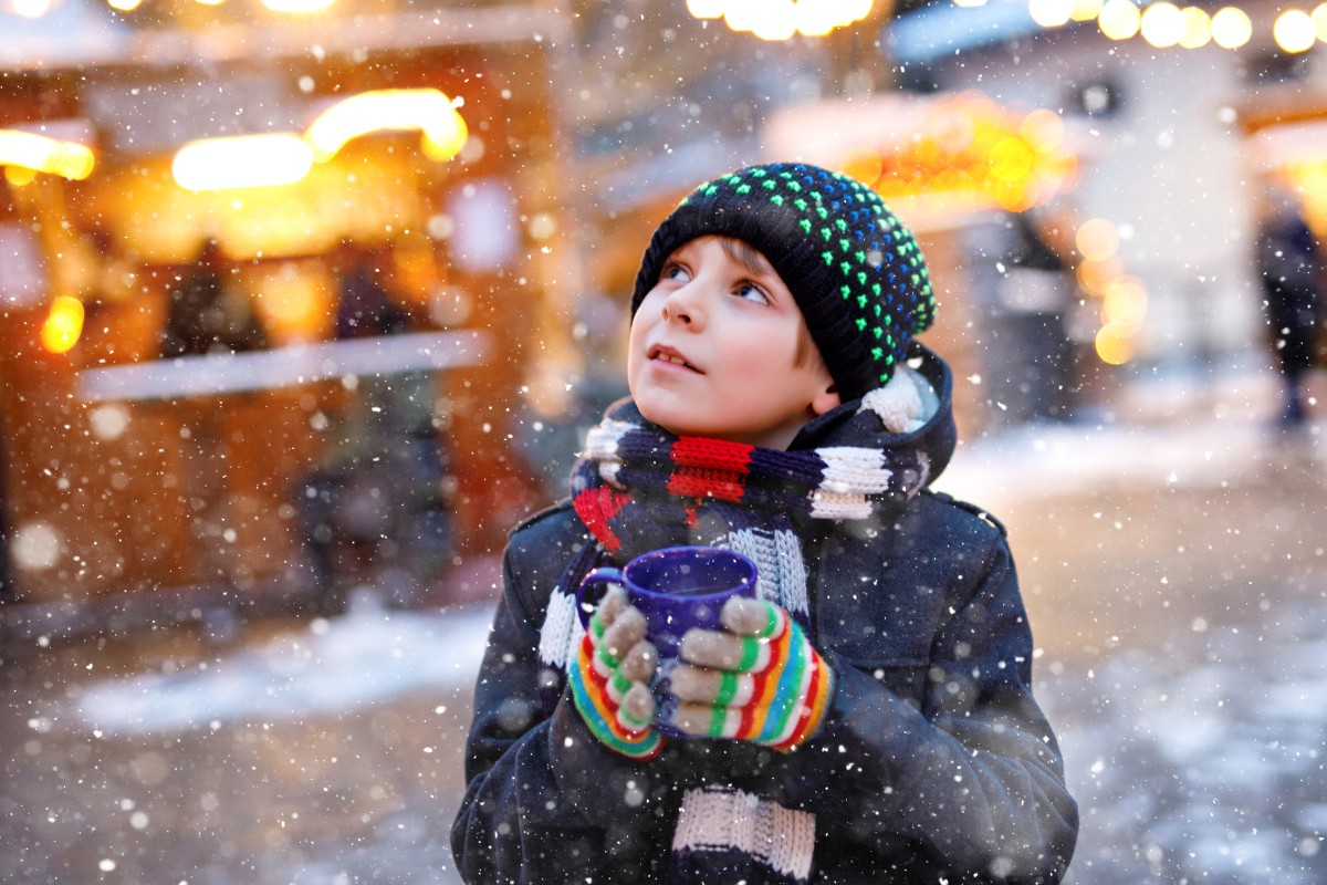 Boy drinking hot punch at the Nuremberg Christmas Market by Romrodinka