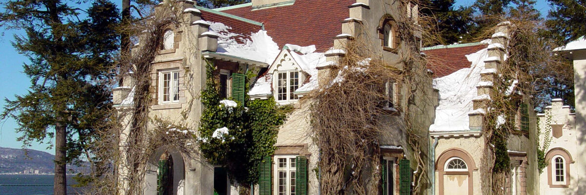 Washington Irving's Sunnyside cottage with snow on a sunny day.