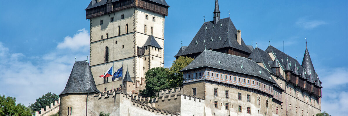 Karlstejn Castle in the Czech Republic with blue sky by VrabelPeter1