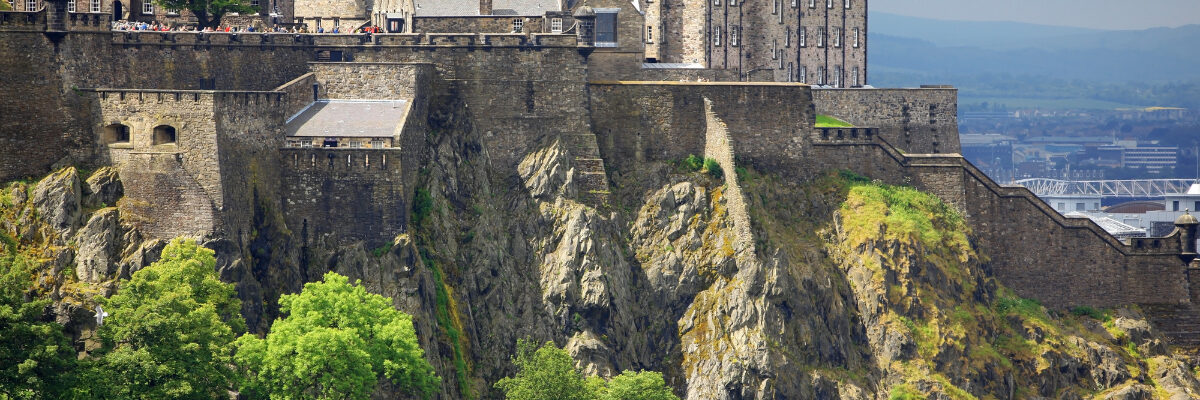 Edinburgh Castle on a hilltop as seen from a distance by konstantin 32