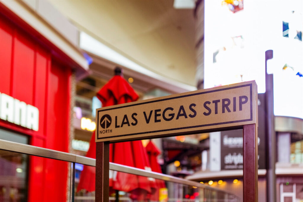 Things to do in Vegas for couples. Sign says "North (to) Las Vegas Strip."